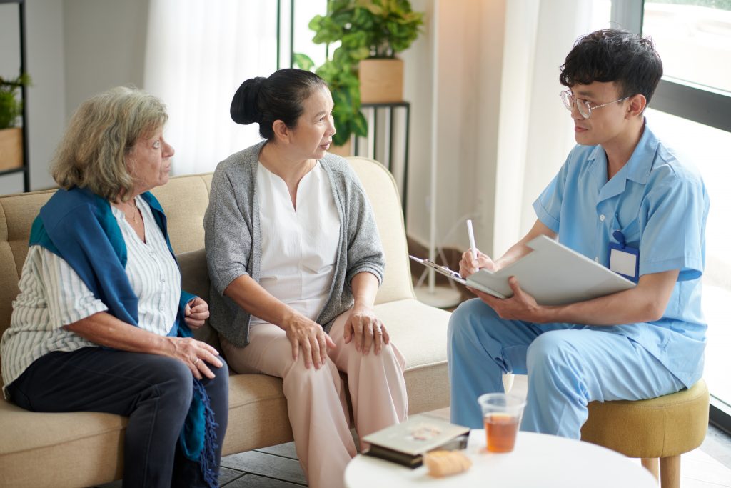 Nursing Home Doctor Talking to Patients